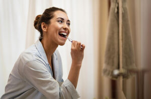 Brushing teeth carefully after wisdom teeth removal for proper oral hygiene