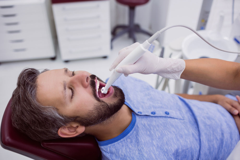 Dentist performing a tooth extraction on a patient
