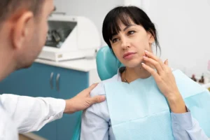 Dentist doing checkup on patient after Wisdom Teeth Removal