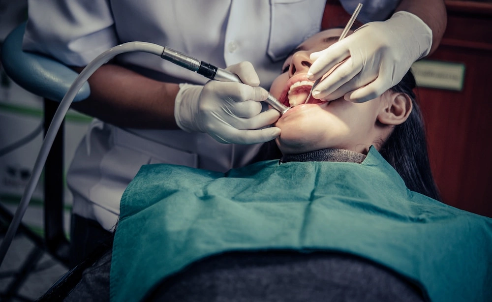 A female patient undergoing an expert wisdom teeth removal procedure at a professional dental clinic in Sydney.