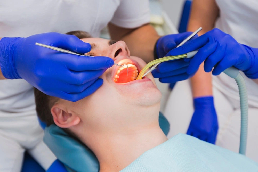 A patient undergoing a wisdom teeth removal procedure by a professional dental team in a Sydney clinic.